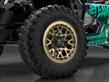 A closeup shot of the TIS-UT1 tire on a green and black UTV featuring gold TIS OFFROAD wheels