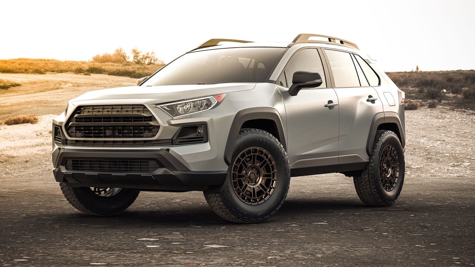 A gray Bronco skewed right on a mountain landscape outfitted in Hercules TERRA TRAC® AT X-VENTURE tires.