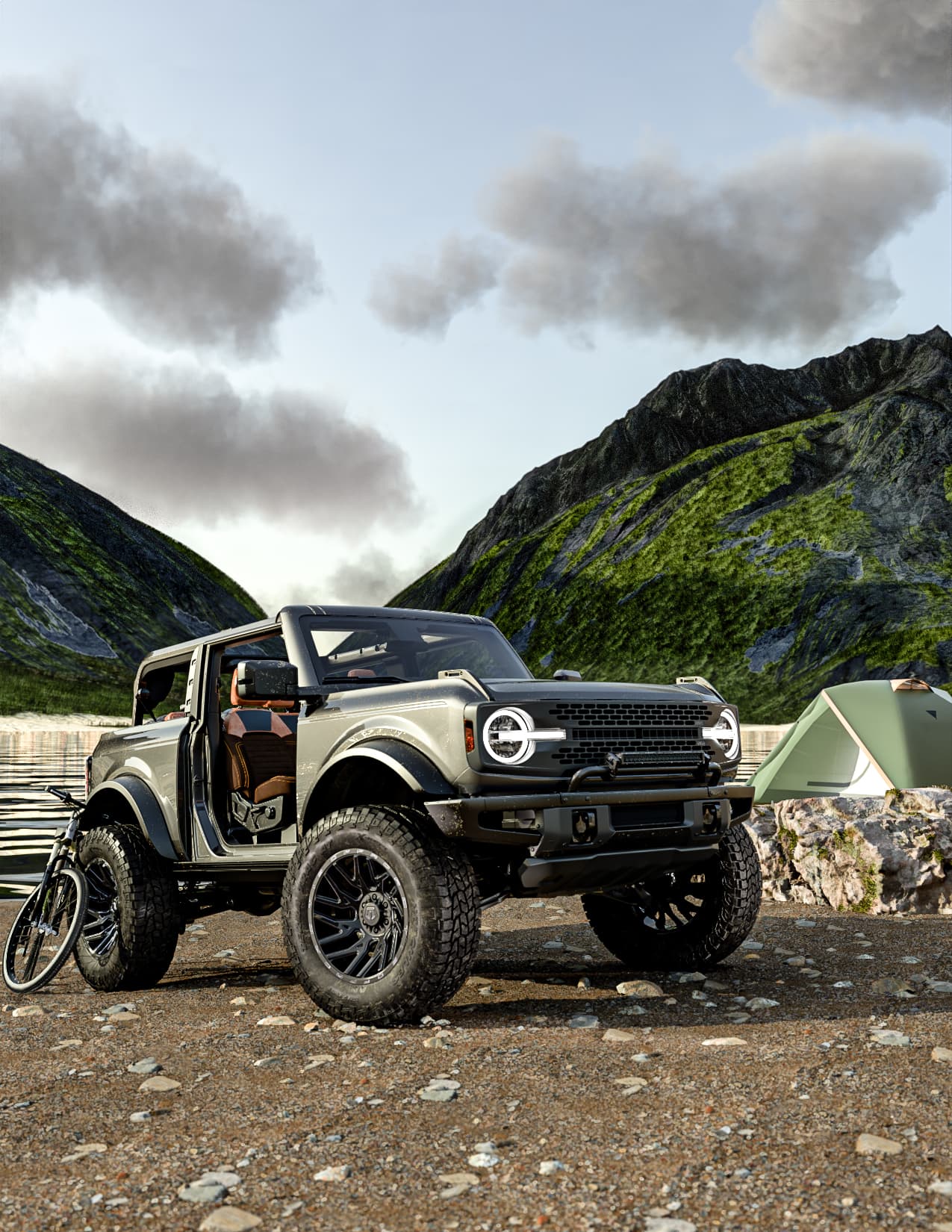 A gray Bronco skewed right on a mountain landscape outfitted in Hercules TERRA TRAC® AT X-VENTURE tires.