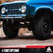 The front-right view of a blue, Jeep-like car getting ready to drive. The Hercules branding at the bottom says "#TIRETIPTIME."