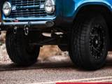 The front-right view of a blue, Jeep-like car getting ready to drive. The Hercules branding at the bottom says "#TIRETIPTIME."