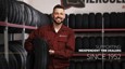 A white male independent tire dealer holds a Hercules Tire in his showroom. The text in the corner says "Supporting independent tire dealers since 1952."